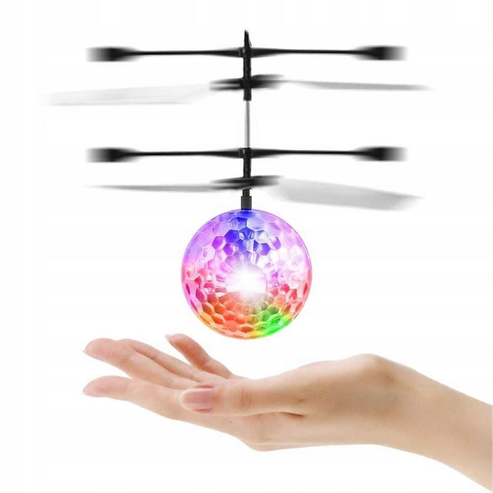 BALL FLYING OVER THE HAND CONTROLLED BY HAND GLOWING MAGIC DRONE HELICOPTER