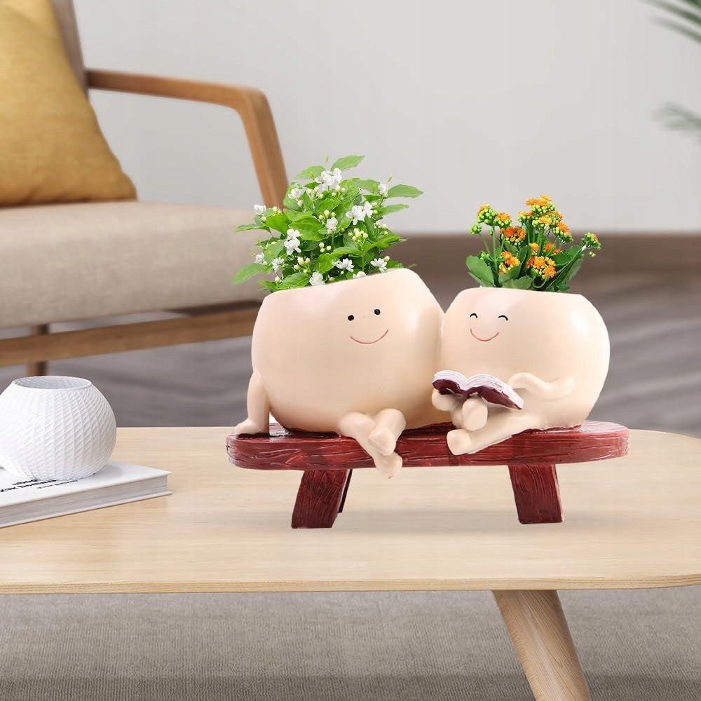 CUTE FLOWER POT WITH FACES WITH A SMILE ON THE BENCH POTS DECORATIONS Product height 11 cm