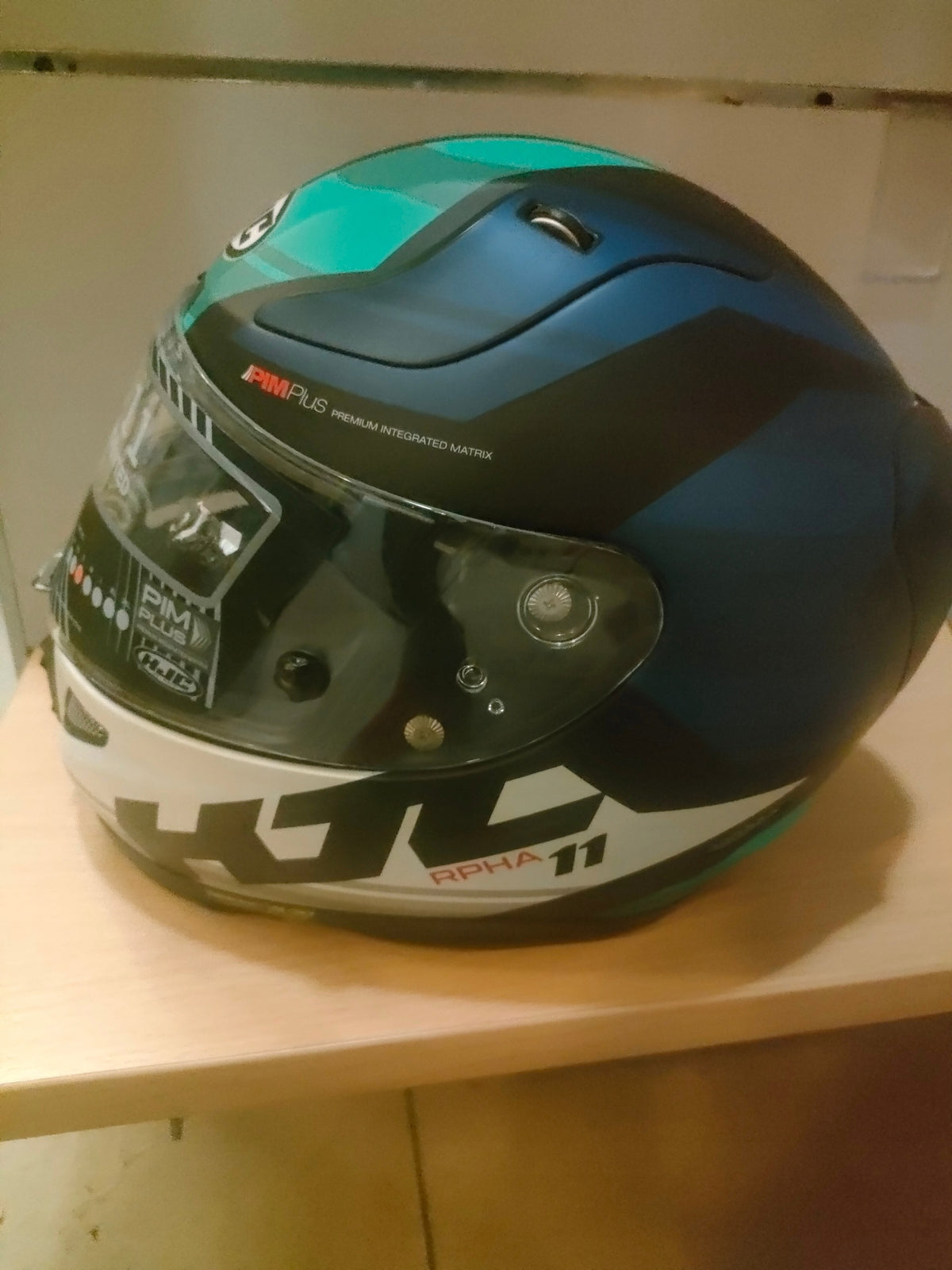 Motorcycle helmet HJC RPHA 11Naxos r. S white and grey blue Manufacturer HJC