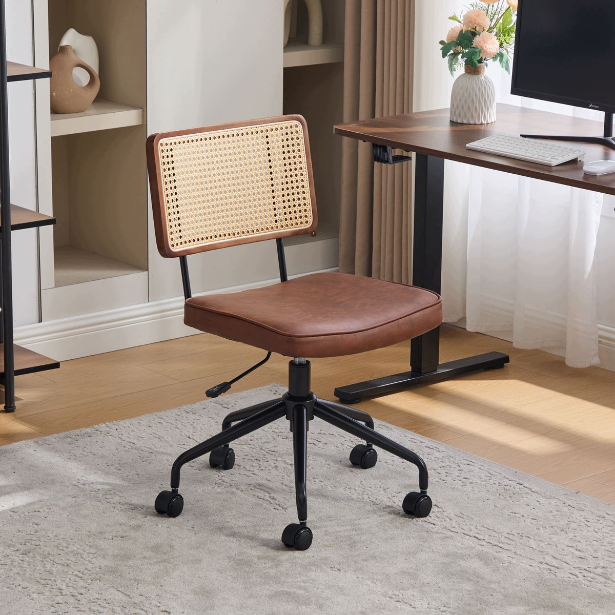 Vintage rattan office chair on wheels with leather seat