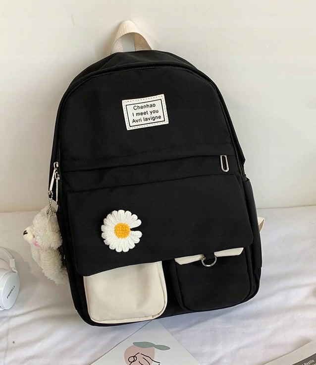 Youth backpack, decorated with daisy embroidery, in black and white colors