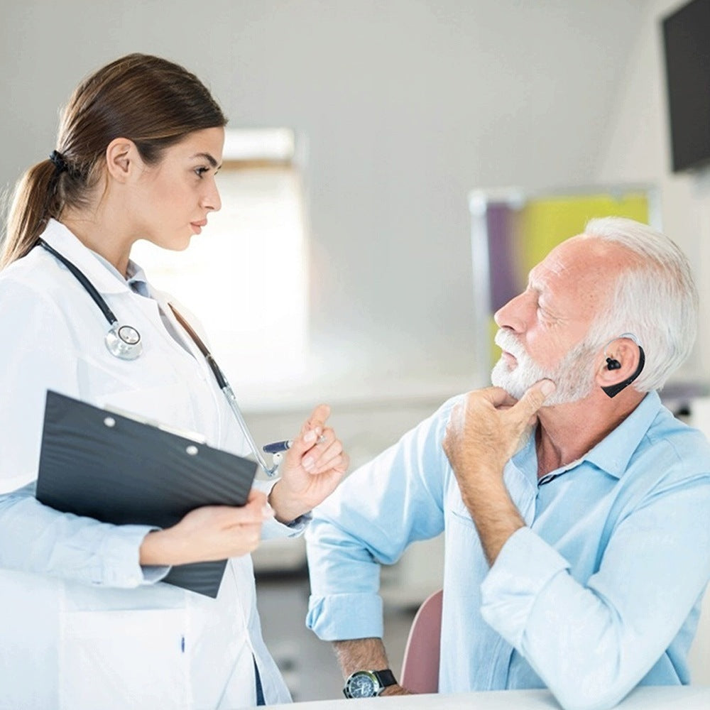 Discreet Black Hearing Aid with Volume Control and Charging Station Medical device no