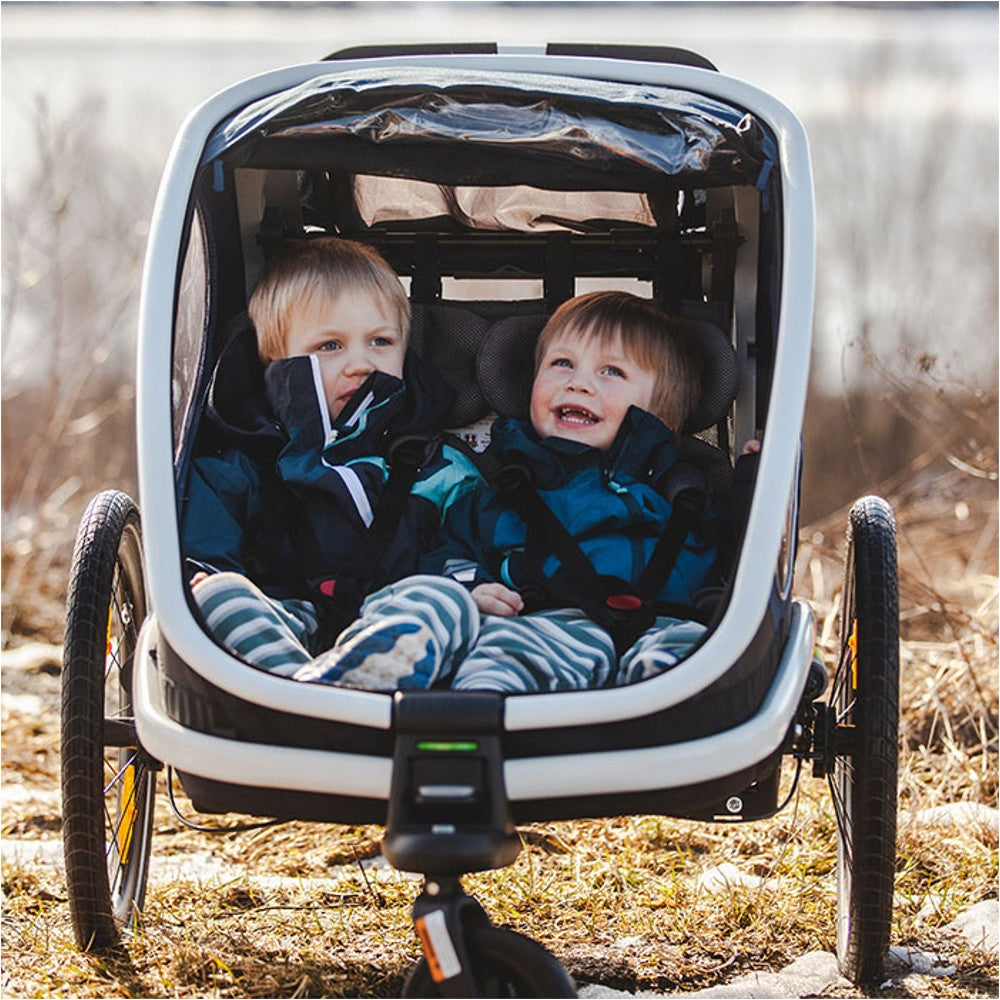 Hamax Outback Twin Baby Trailer Green 22kg 2 Children Stroller Additional features shock absorption safety flag rain cover brake mosquito net hi-vis reflectors sun visors lighting pumped wheels cargo space foldable trailer design bicycle trailer hook