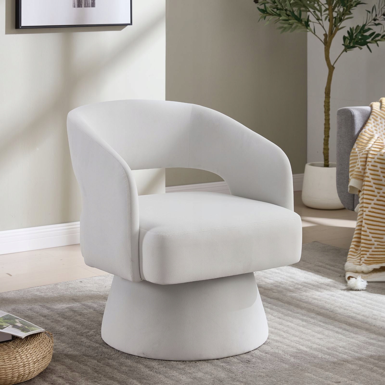 Modern and comfortable velvet armchair with round legs and open backrest