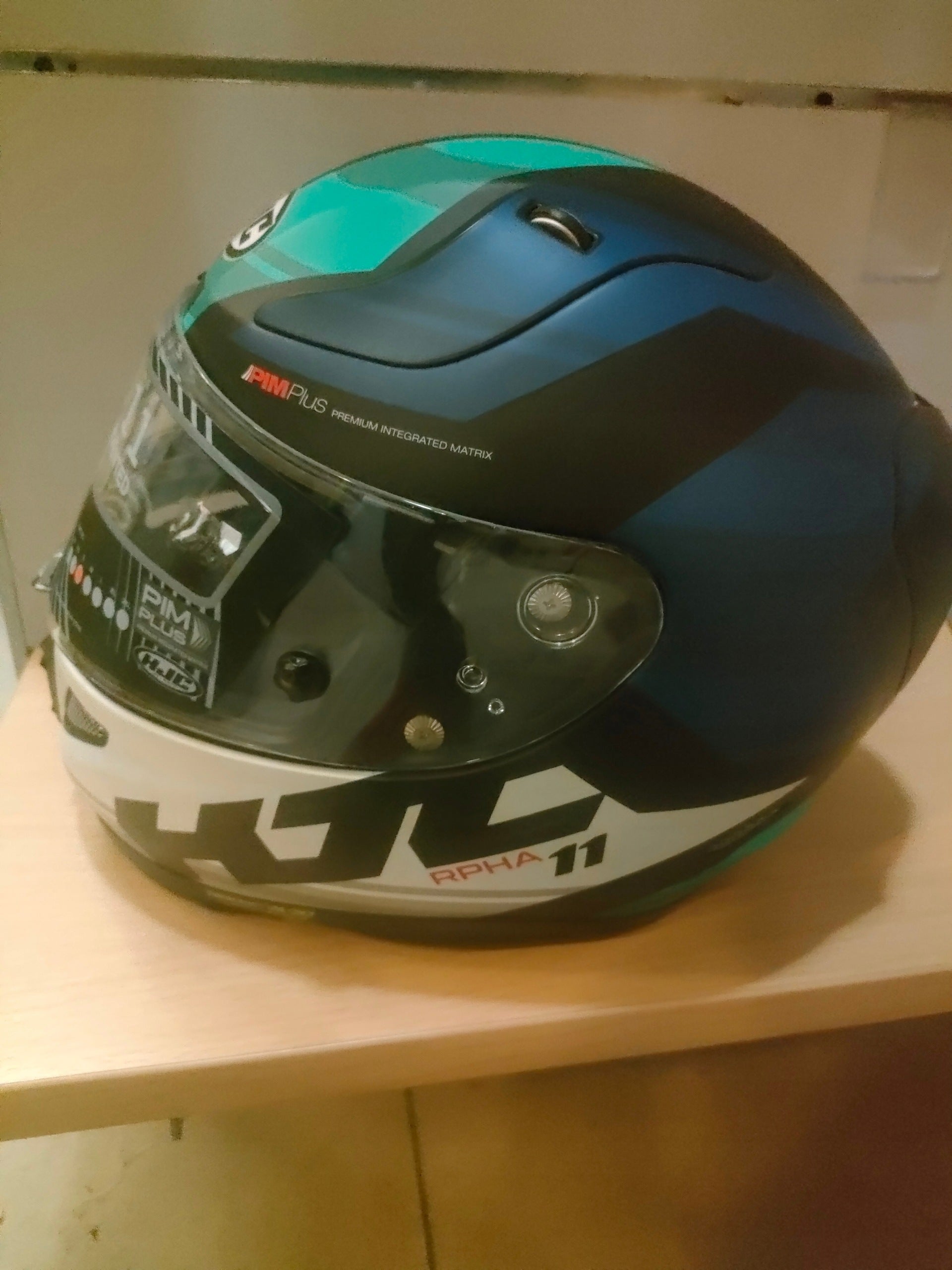 Motorcycle helmet HJC RPHA 11Naxos r. S white and grey blue Manufacturer HJC