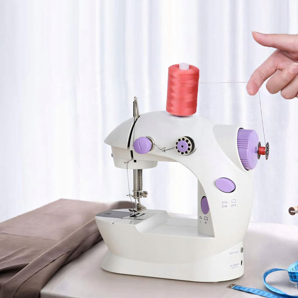 Portable mini sewing machine with pedal and 2 speed machine Batteries included no