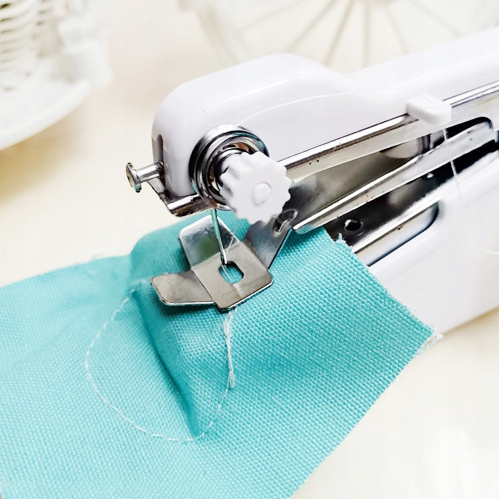 SEWING MACHINE MINI HANDHELD PORTABLE BATTERY TRAVEL NEEDLE 3x THREAD Model E138