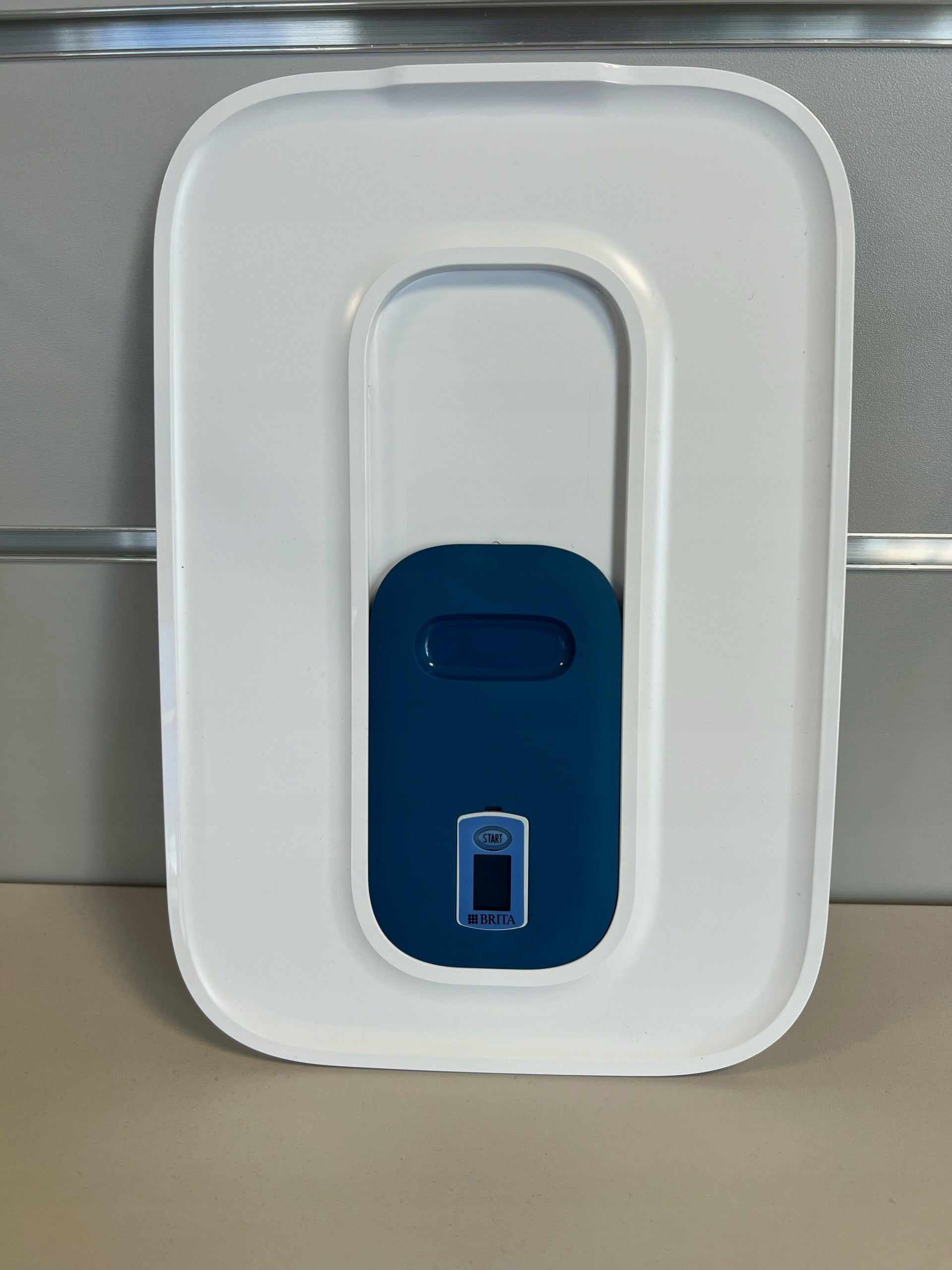Tilting water filler flap for Brita Optimax distributor